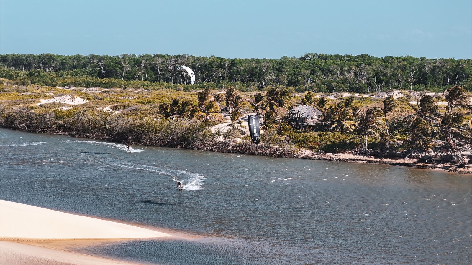 Aerial view of Atins flat-water lagoons and dunes, Lençóis Maranhenses, Brazil — kite camp with Beto Gómez