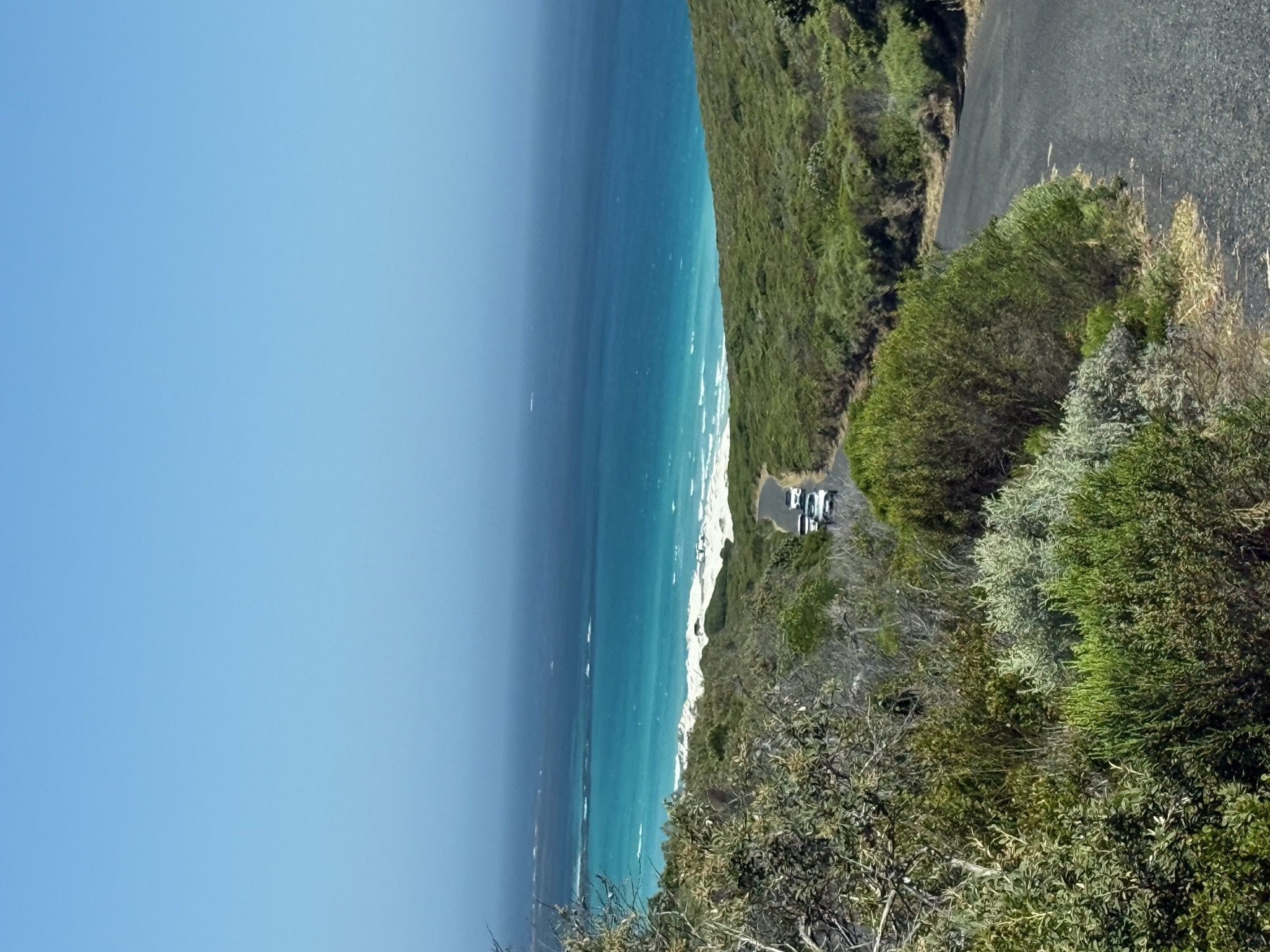 Aerial view of Cape Town coastline with turquoise Atlantic Ocean and green cliffs — South Africa kite expedition