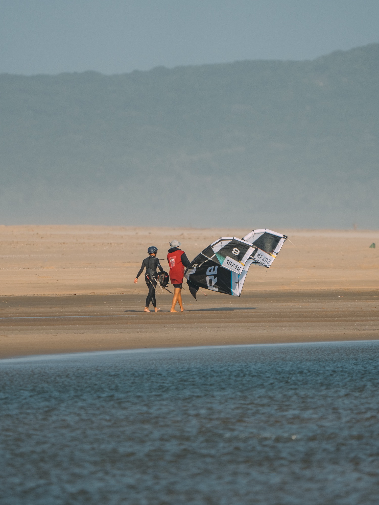 private crew of friends laughing together on a boat custom kite expedition Local Secrets XP