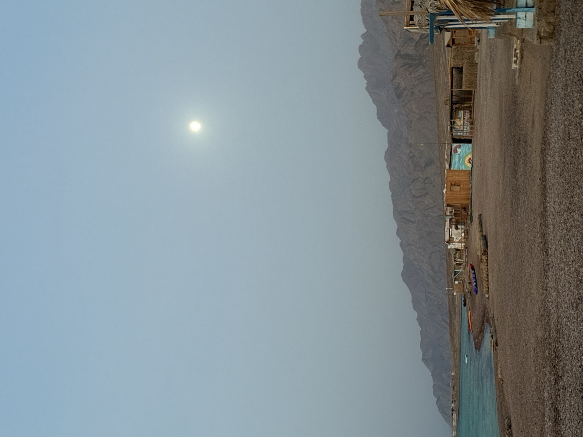 Moon rising over Dahab with Sinai mountain silhouettes — Egypt kite expedition