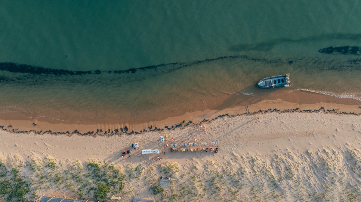 Aerial view of local fishing boat and beach camp on Inhaca Island — Mozambique kite expedition base