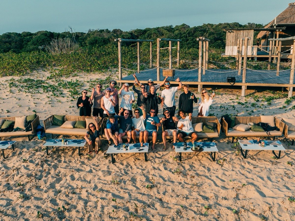 Expedition group relaxing at beach lounge on Inhaca Island, aerial view — Mozambique kite trip